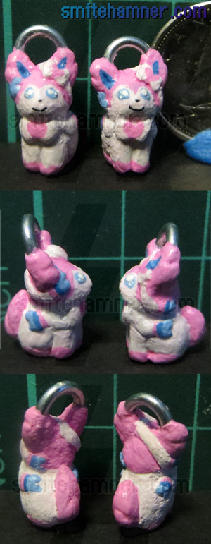A set of photos showing very small sculpts of the pokemon Sylveon